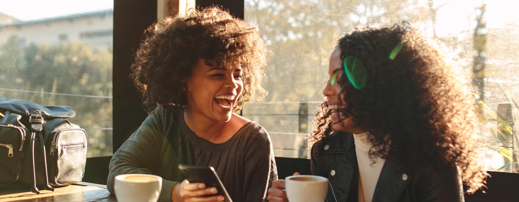 Two women talking at a coffee shop